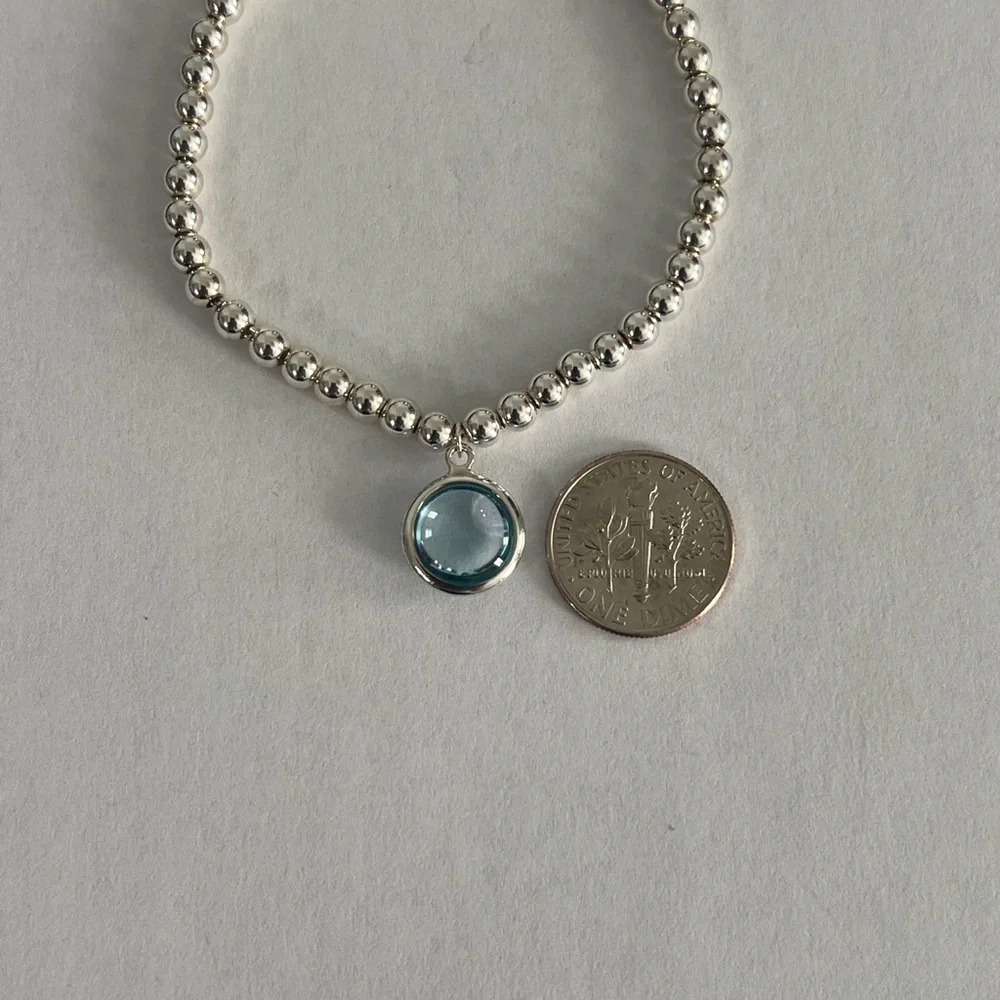 Elegant Silver Beaded Bracelet with Blue Charm